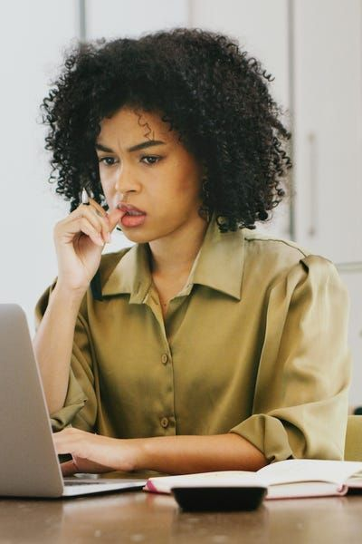Confused woman at laptop